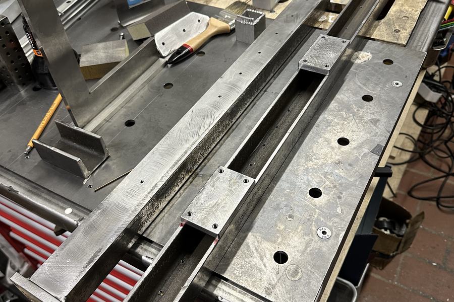 Frame with welded mounting plates
