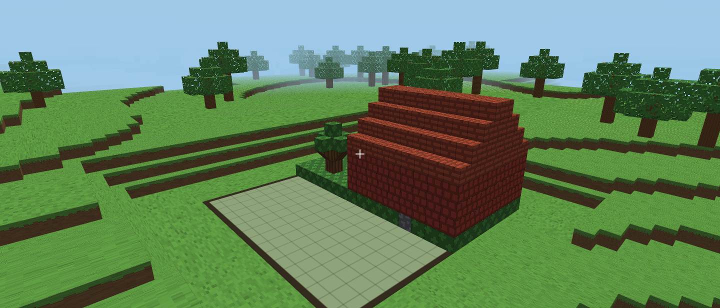 A child's house in Blocks: brick walls, a stepped roof and a little garden, built on one printable plate.